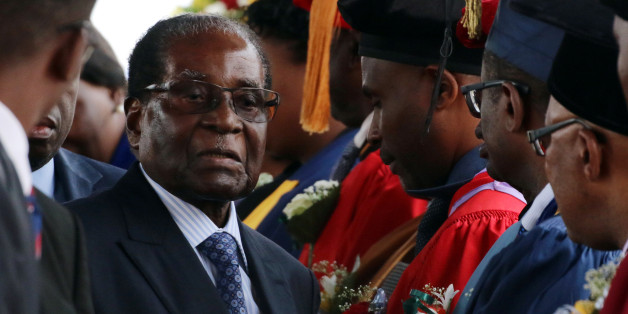 Zimbabwe President Robert Mugabe attends a university graduation ceremony in Harare, Zimbabwe, November 17, 2017. REUTERS/Philimon Bulawayo