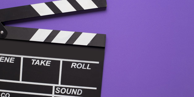 movie clapper on violet background