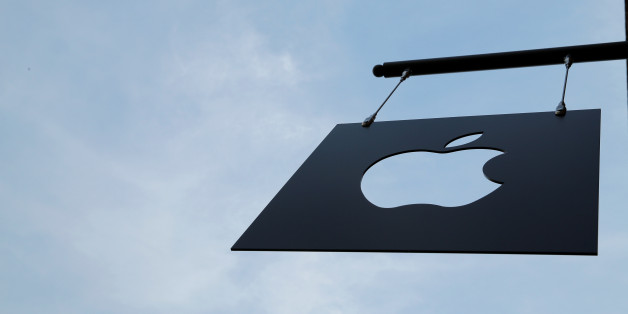 The Apple logo hangs from the front of the new Apple Store Williamsburg in Brooklyn, New York, U.S., July 28, 2016. REUTERS/Andrew Kelly