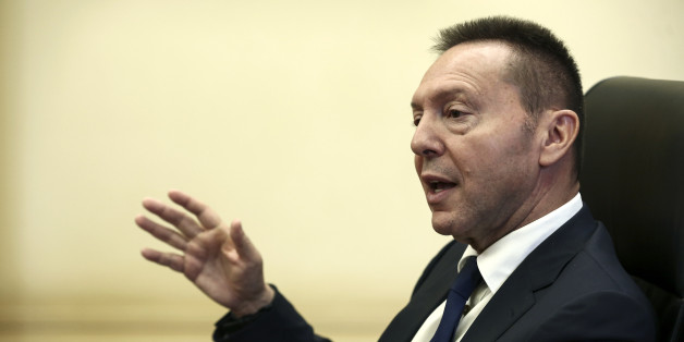 Yannis Stournaras, governor of the Bank of Greece, gestures as he speaks during an interview at the bank's headquarters in Athens, Greece, on Friday, Nov. 25, 2016. It's 'far too early' to talk about winding down European Central Bank bond purchases, Stournaras said. Photographer: Yorgos Karahalis /Bloomberg via Getty Images