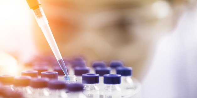 Female chemist at work in laboratory.