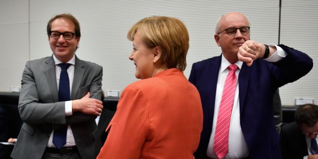 German Chancellor Angela Merkel stands inbetween German Transport Minister Alexander Dobrindt (L) and Parliamentary group leader of the conservative CDU/CSU faction, Volker Kauder (R) prior to a parliamentary group meeting of the conservative CDU/CSU faction on November 20, 2017 in Berlin.
Following more than a month of gruelling negotiations, the leader of the pro-business FDP, Christian Lindner, walked out of talks overnight, on November 19, 2017 saying there was no 'basis of trust' to forge a government with Merkel's conservative alliance CDU-CSU and the ecologist Greens. / AFP PHOTO / John MACDOUGALL (Photo credit should read JOHN MACDOUGALL/AFP/Getty Images)