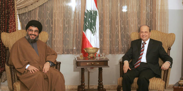 Beirut, LEBANON: Hezbollah secretary general Hassan Nassrallah (L) and anti-Syrian legislator General Michel Aoun meet for the first time at a church in the southern suburb of Beirut 06 February 2006. Lebanon pointed the finger at Syria after the Danish consulate was torched during violent protests over controversial Prophet Mohammed cartoons that left one rioter dead and led to the interior minister's resignation. AFP PHOTO/JOSEPH BARRAK (Photo credit should read JOSEPH BARRAK/AFP/Getty Image