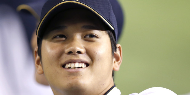 Japan's pitcher Shohei Otani, who both pitches and hits for the Nippon Ham Fighters, attends a practice session before an exhibition baseball game against U.S. Major League Baseball (MLB) All-Stars in Tokyo November 14, 2014. Otani has made waves in Japan by throwing strikes and smashing home runs for the Nippon Ham Fighters, but the 'Double Sworded Samurai' may have to give up one of his weapons if he is to realise his dream of making it big in Major League Baseball. Picture taken November 14,