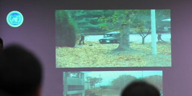 A surveillance TV footage containing the moment of defection of a North Korean Soldier, is seen during a press briefing by the United Nations Command at the Defence Ministry in Seoul on November 22, 2017.
A North Korean soldier crossed the border into the South in breach of a 1953 armistice agreement as he pursued a defector who was shot last week, the US-led United Nations Command (UNC) said on November 22. / AFP PHOTO / JUNG Yeon-Je (Photo credit should read JUNG YEON-JE/AFP/Getty Images)