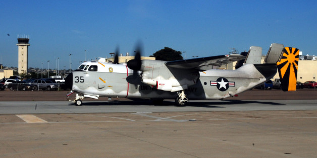 SAN DIEGO - NOVEMBER 9: In this photo provided by the U.S. Navy, A C-2A Greyhound from Fleet Logistics Squadron (VRC) 30 taxis on the runway after sailors from loaded it with meat, bread and plastic dinnerware November 9, 2010 at Naval Base Coronado in Sand Diego, California. VRC-30 is transferring the supplies to the aircraft carrier USS Ronald Reagan, which will deliver them to the Carnival Splendor, a cruise ship that lost power and became stranded early Monday about 250 miles off of California after a fire in the engine room. (Photo by Jeremy M. Starr/U.S. Navy via Getty Images)