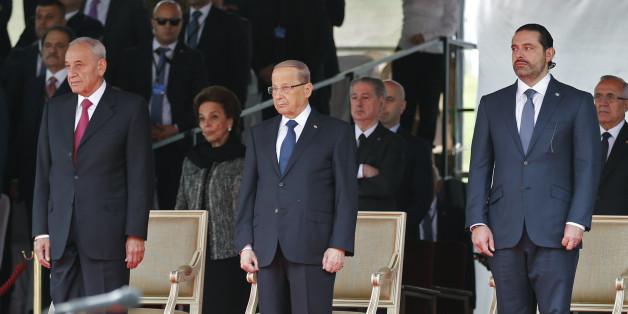 Lebanese prime minister Saad Hariri (R), President Michel Aoun (C) and House Speaker Nabih Berri attend a military parade to celebrate the 74th anniversary of Lebanon's independence in downtown Beirut, on November 22, 2017.Lebanon's prime minister Saad Hariri returned to his home country late, on the eve of its independence day and after a nearly three-week absence dominated by his surprise resignation. / AFP PHOTO / ANWAR AMRO (Photo credit should read ANWAR AMRO/AFP/Getty Images)