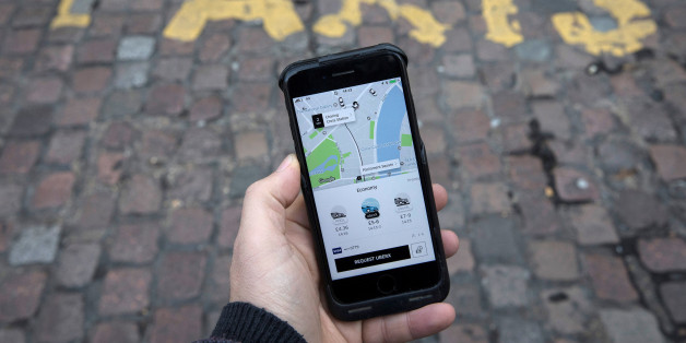 A photo illustration shows the Uber app on a mobile telephone, as it is held up for a posed photograph, in London, Britain November 10, 2017. REUTERS/Simon Dawson