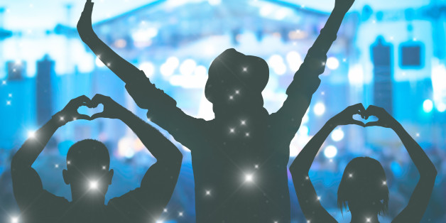 Friends enjoying concert / music festival.