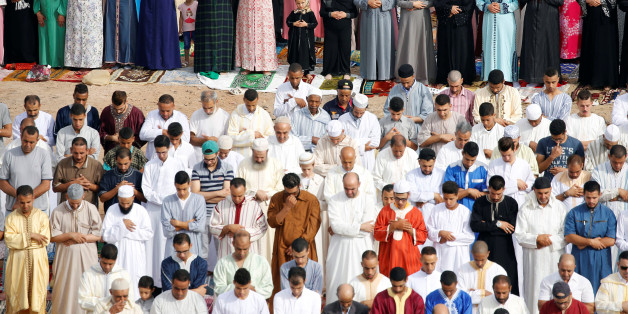 People attend Eid al-Fitr prayers to mark the end of the holy fasting month of Ramadan at a play ground in the suburb of Sale, Morocco June 26, 2017. REUTERS/Youssef Boudlal
