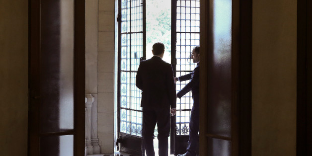 Greek Prime Minister Alexis Tsipras waits for Cypriot President Nicos Anastasiades (not pictured) at the entrance of the Maximos Mansion in Athens, Greece December 30, 2016. REUTERS/Alkis Konstantinidis