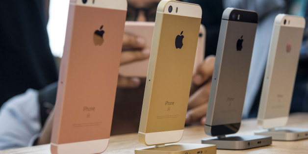 An attendee takes a photograph of the new Apple Inc. iPhone SE smartphone after an event in Cupertino, California, U.S., on Monday, March 21, 2016. Apple Inc. unveiled a new, smaller iPhone that will start at $399, seeking to jump-start sales of its flagship product by enticing more users to upgrade, especially in high-growth markets such as China and India. Photographer: David Paul Morris/Bloomberg via Getty Images