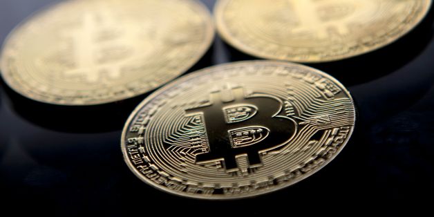 Gold plated souvenir Bitcoin coins are arranged for a photograph in London on November 20, 2017. Bitcoin, a type of cryptocurrency, uses peer-to-peer technology to operate with no central authority or banks. Bitcoin's recent rise and booming investor interest is forcing the regulatory and stock market authorities to formulate an official position on bitcoin and other virtual currencies, which are controversial not only because of their speculative nature, but are also seen as vehicles for illega