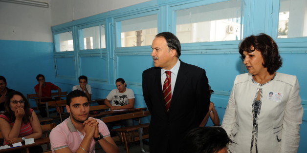 Tunisian Education Ministre Hatem Ben Salem (C) accompanied by the school's headmaster Jamila Sakka (R) meet Tunisian students taking the baccalaureat (high school graduation exam) exam on June 9, 2010 in Tunis. AFP PHOTO / FETHI BELAID (Photo credit should read FETHI BELAID/AFP/Getty Images)