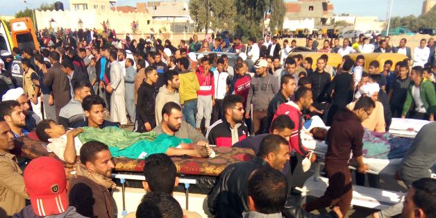 Egyptians carry victims on stretchers following a gun and bombing attack on the Rawda mosque near the North Sinai provincial capital of El-Arish on November 24, 2017.Armed attackers killed at least 235 worshippers in a bomb and gun assault on the packed mosque in Egypt's restive North Sinai province, in the country's deadliest attack in recent memory. / AFP PHOTO / - (Photo credit should read -/AFP/Getty Images)