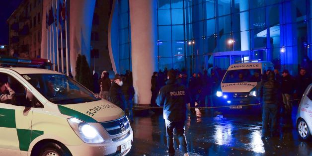 Georgian police investigators and ambulance cars are seen in front of the Leogrand hotel in Georgia's Black Sea resort city of Batumi on November 24, 2017.
At least 12 people died and a dozen were injured on November as a fire ripped through an upmarket hotel in Georgia's Black Sea resort city of Batumi.
/ AFP PHOTO / Seyran BAROYAN (Photo credit should read SEYRAN BAROYAN/AFP/Getty Images)