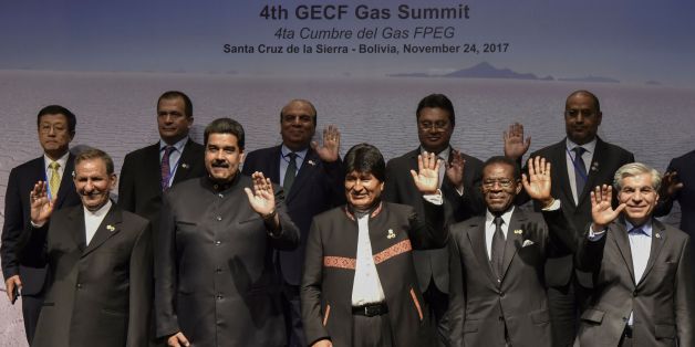 (L to R front)Iranian Vice-President Eshaq Yahanguiri, Venezuelan President Nicolas Maduro, Bolivian President Evo Morales, Equatorial Guinea's President Teodoro Obiang and Mohammad Hossein Adeli, general secretary of Gas Exporting Countries Forum waves during the family picture of the IV Gas Exporting Countries Summit in Santa Cruz de la Sierra, Bolivia on November 24, 2017. / AFP PHOTO / AIZAR RALDES (Photo credit should read AIZAR RALDES/AFP/Getty Images)