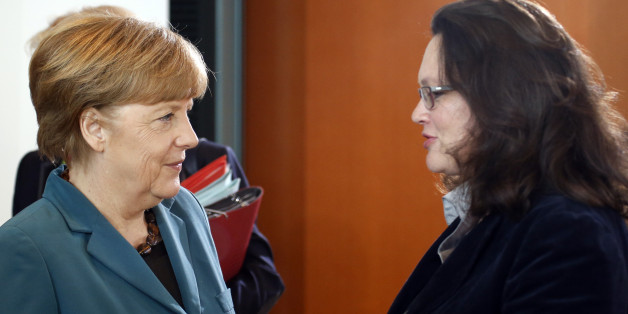 German Chancellor Angela Merkel (L) listens to Labour Minister Andrea Nahles during a cabinet meeting at the Chancellery in Berlin April 30, 2014. REUTERS/Fabrizio Bensch (GERMANY - Tags: POLITICS)