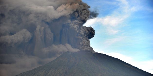 General view of Mount Agung during an eruption seen from Kubu sub-district in Karangasem Regency, on Indonesia's resort island of Bali on November 26, 2017. Mount Agung belched smoke as high as 1,500 metres above its summit, sparking an exodus from settlements near the mountain. / AFP PHOTO / SONNY TUMBELAKA (Photo credit should read SONNY TUMBELAKA/AFP/Getty Images)