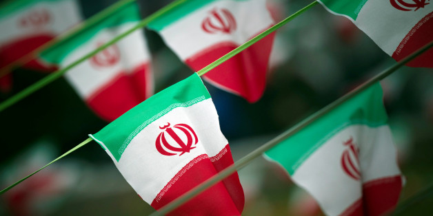 FILE PHOTO: Iran's national flags are seen on a square in Tehran February 10, 2012, a day before the anniversary of the Islamic Revolution. REUTERS/Morteza Nikoubazl/File Photo