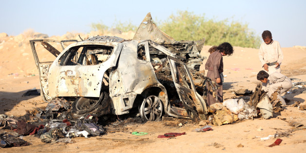 Boys inspect the wreckage of a car hit by a drone air strike near the northern city of Marib, Yemen November 3, 2017. REUTERS/Ali Owidha