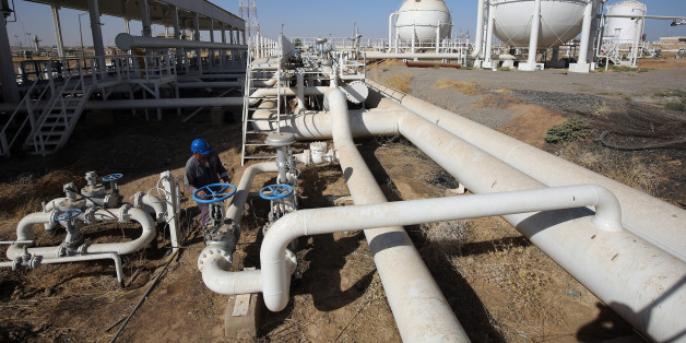 An Iraqi oil employee checks pipelines at the Bai Hassan oil field, west of the multi-ethnic northern Iraqi city of Kirkuk, on October 19, 2017.Kurdish peshmerga forces withdrew without a fight after federal government troops and militia entered Kirkuk, seizing the provincial governor's office and key military bases in response to a Kurdish vote for independence in September 2017. / AFP PHOTO / AHMAD AL-RUBAYE (Photo credit should read AHMAD AL-RUBAYE/AFP/Getty Images)