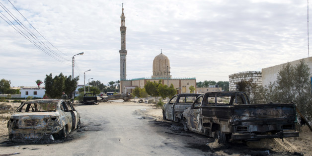 TOPSHOT - A picture taken on November 25, 2017, shows the Rawda mosque, roughly 40 kilometres west of the North Sinai capital of El-Arish, after a gun and bombing attack.Armed attackers killed at least 235 worshippers in a bomb and gun assault on the packed mosque in Egypt's restive North Sinai province, in the country's deadliest attack in recent memory. / AFP PHOTO / STR (Photo credit should read STR/AFP/Getty Images)