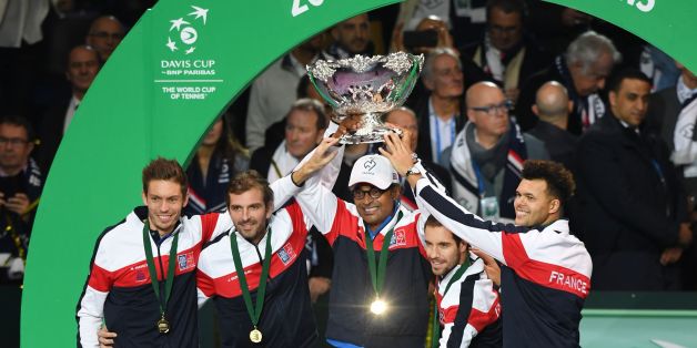 (From top L) France's Nicolas Mahut, Julien Benneteau, Yannick Noah, Richard Gasquet and Jo-Wilfried Tsonga pose with the trophy after winning the Davis Cup World Group final tennis match between France and Belgium at The Pierre Mauroy Stadium in Villeneuve d'Ascq near Lille on November 26, 2017. / AFP PHOTO / Denis Charlet (Photo credit should read DENIS CHARLET/AFP/Getty Images)