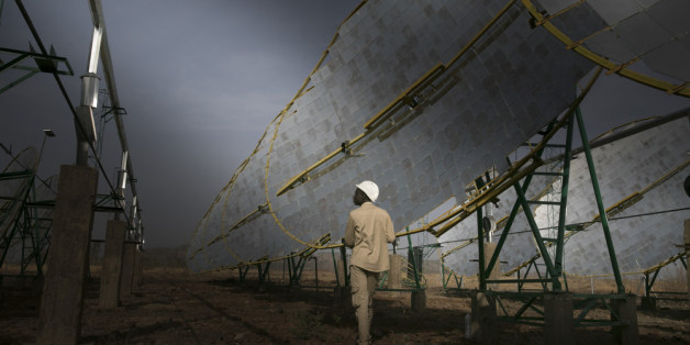 Dano, Burkina Faso - February 28: Production of solar energy through concave mirrors. A worker is testing the solar system in the evening. The energy gained supplies electricity to a rice processing plant of the Dreyer Foundation on February 28, 2017 in Dano, Burkina Faso. (Photo by Ute Grabowsky/Photothek via Getty Images)
