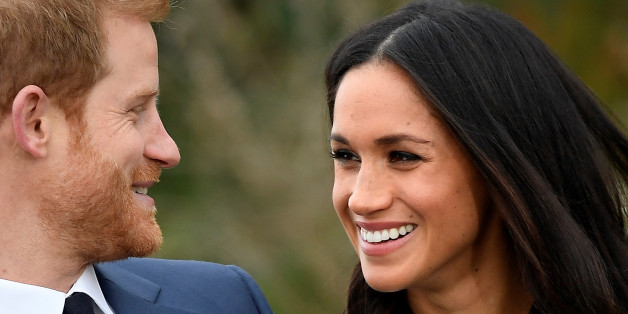 Britain's Prince Harry poses with Meghan Markle in the Sunken Garden of Kensington Palace, London, Britain, November 27, 2017. REUTERS/Toby Melville