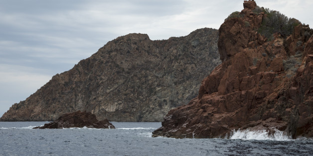 Volcanic coastal landscape of the Scandola Nature Reserve on 15th September 2017 in Corsica, France. The Scandola Nature Reserve is located on the west coast of the Corsica, within the Corsica Regional Park. The reserve was established in 1975 and has been recognized by the United Nations as a Natural World Heritage Site, and was inscribed on the World Heritage List in 1983. (photo by Mike Kemp/In Pictures via Getty Images)