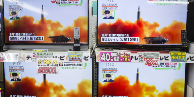 Televisions being sold at an Onoden Co. electronics store display a broadcast of a news report on North Korea's Nov. 29 missile launch, showing footage captioned as the launch of the Hwasong-12 missile in September, in Tokyo, Japan, on Wednesday, Nov. 29, 2017. North Korean leader Kim Jong Un said his regime completed its nuclear program after firing a missile that put the entire U.S. in range. Photographer: Keith Bedford/Bloomberg via Getty Images