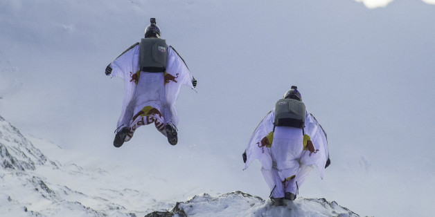 LAUTERBACH, SWITZERLAND - OCTOBER 13: In this handout image provided by Red Bull, wingsuit flyers Fred Fugen and Vince Reffet, known as the Soul Flyers, catching up and fly into a Pilatus Porter plane, piloted by Philippe Bouvier, in mid air after jumping off the Jungfrau mountain on October 13, 2017 in Lauterbach, Switzerland. After B.A.S.E. jumping from the 4,158 meters high mountain the French athletes had 2.45 minutes and a free fall distance of 3,200 meters to complete their project 'Door I