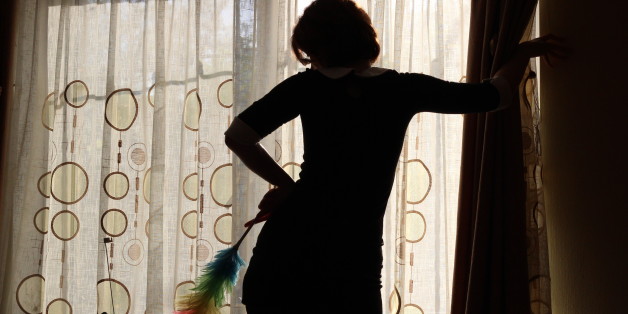 Silhouette of the girl engaged in cleaning in a black dress and stockings with a brush to dust pipidastrSilhouette of the girl engaged in cleaning in a black dress and stockings with a brush to dust pipidastr