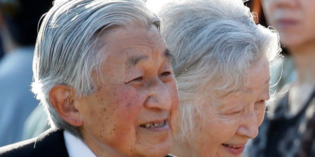 Japan's Emperor Akihito (L), flanked by Empress Michiko, greets guests during the annual autumn garden party at the Akasaka Palace imperial garden in Tokyo, Japan, November 9, 2017. REUTERS/Toru Hanai
