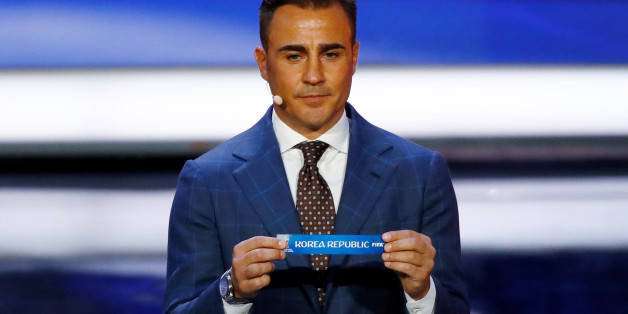 Soccer Football - 2018 FIFA World Cup Draw - State Kremlin Palace, Moscow, Russia - December 1, 2017 Fabio Cannavaro pulls out Korea Republic during the draw REUTERS/Kai Pfaffenbach
