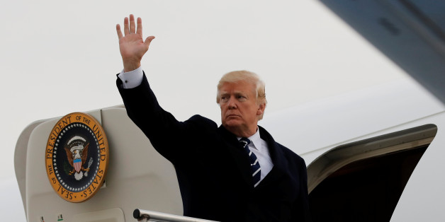 U.S. President Donald Trump waves as he boards Air Force One at John F. Kennedy International Airport in New York, before his departure back to Washington, U.S., December 2, 2017. REUTERS/Yuri Gripas