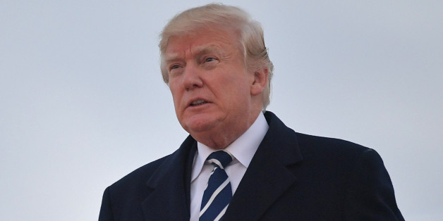 US President Donald Trump steps off Air Force One upon arrival at Andrews Air Force Base in Maryland on December 2, 2017. Trump is returning to Washington, DC after attending fundraisers in New York, New York. / AFP PHOTO / MANDEL NGAN (Photo credit should read MANDEL NGAN/AFP/Getty Images)