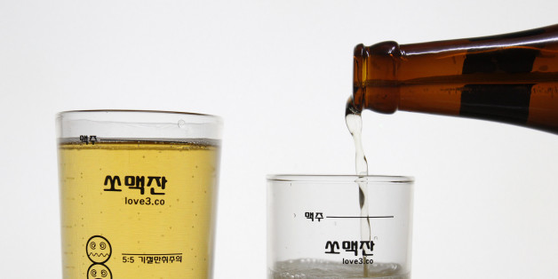 Glass measuring cups which have markings for mixing and cartoon faces for each different combination are seen in this picture illustration at the cup seller Love3's factory in Seoul June 7, 2011. Somaek, the mix of Korea's national alcohol soju -- a distilled vodka-like liquor -- with beer, is a popular tipple for many Koreans who find straight soju too strong, but aren't that keen on beer by itself. As a result, one lively debate when Koreans gather to drink is the best ratio of the concoction. For some, pouring soju and beer into glasses is a chance to brag about their mixology skills and prime somaek combinations. But now, a new glass measuring cup takes the mystery out of making the concoction, allowing partiers to mix according to their favourite taste every time. The cup provides guides for all possible permutations, from the 1:9 soju to beer mix described as "gentle and smooth" up to "Blackout" -- a 5:5 mix. Picture taken on June 7, 2011. To match Reuters Life! KOREA-DRINKING/ REUTERS/Truth Leem (SOUTH KOREA - Tags: SOCIETY)