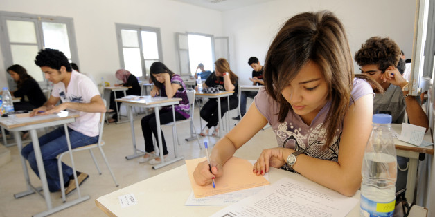 Tunisian students take the baccalaureat (high school graduation exam) exam on June 6, 2012 in Tunis. Some 129 181 candidates registered for the main session of the baccalaureat held this year from June 6 to 13. The average female candidates stood at 57.06% against 42% for boys. The Bachelor 2012 will be marked by the application of an adult aged 64 years and five students who are serving a prison sentence. The exam results will be announced on June 23, 2012. AFP PHOTO / FETHI BELAID (Phot