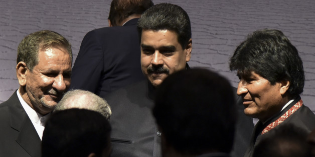 Iranian Vice-President Eshaq Yahanguiri (L)Venezuelan President Nicolas Maduro and Bolivian President Evo Morales (R) speak during IV Gas Exporting Countries Summit in Santa Cruz de la Sierra, Bolivia on November 24, 2017. / AFP PHOTO / AIZAR RALDES (Photo credit should read AIZAR RALDES/AFP/Getty Images)