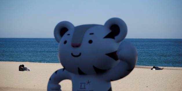 The 2018 PyeongChang Winter Olympics mascot Soohorang is seen as workers lie on the Gyeongpodae beach in Gangneung, South Korea, October 31, 2017. REUTERS/Kim Hong-Ji