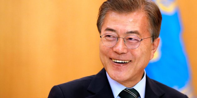 South Korean President Moon Jae-in smiles during an interview with Reuters at the Presidential Blue House in Seoul, South Korea June 22, 2017. REUTERS/Kim Hong-Ji