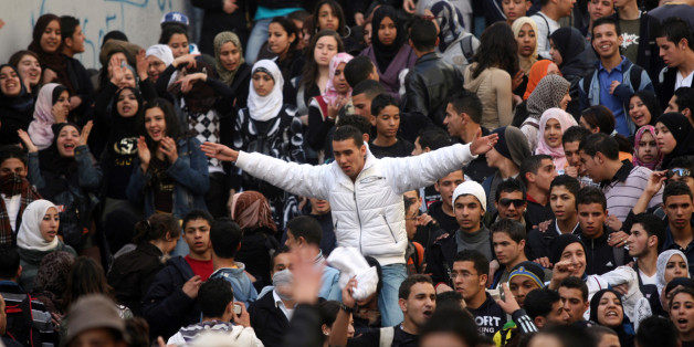 Algerian secondary schools students shout slogans during a protest held in front of a local school in the center of Algiers, 20 January 2008. Students demonstrated in major cities across Algeria to protest against the heavy workload required for the high school graduation exam at the end of the year. AFP PHOTO/FAYEZ NURELDINE (Photo credit should read FAYEZ NURELDINE/AFP/Getty Images)