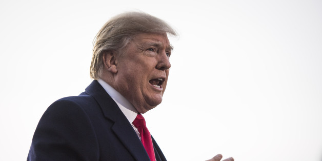 WASHINGTON, DC - DECEMBER 4: President Donald Trump talks to reporters and members of the media as he walks to board Marine One on the South Lawn of the White House in Washington, DC on Monday, Dec. 04, 2017. (Photo by Jabin Botsford/The Washington Post via Getty Images)