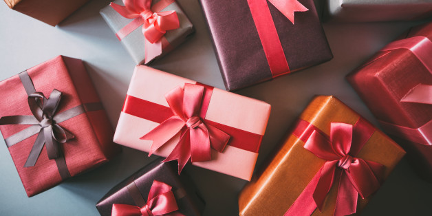 Stylishly packaged boxes with gifts closeup.