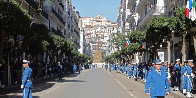 Algerian police stand guard in the street in Algiers during a visit by the French president on December 6, 2017. / AFP PHOTO / ludovic MARIN (Photo credit should read LUDOVIC MARIN/AFP/Getty Images)