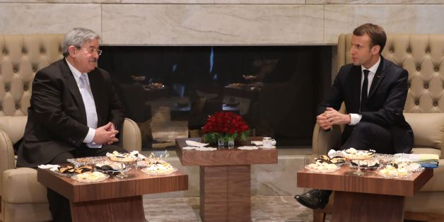 French President Emmanuel Macron (R) meets with Algerian Prime Minister Ahmed Ouyahia at the Zeralda complex on December 6, 2017, in Zeralda. / AFP PHOTO / ludovic MARIN (Photo credit should read LUDOVIC MARIN/AFP/Getty Images)