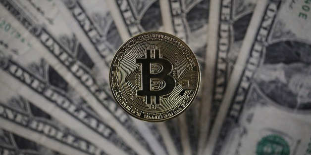 LONDON, ENGLAND - DECEMBER 07: A visual representation of the digital Cryptocurrency, Bitcoin alongside US Dollars on December 07, 2017 in London, England. Cryptocurrencies including Bitcoin, Ethereum, and Lightcoin have seen unprecedented growth in 2017, despite remaining extremely volatile. While digital currencies across the board have divided opinion between financial institutions, and now have a market cap of around 175 Billion USD, the crypto sector coninues to grow, as it continues to see wider mainstreem adoption. The price of one Bitcoin passed 15,000 USD across many exchanges today taking it higher than previous all time highs. (Photo by Dan Kitwood/Getty Images)