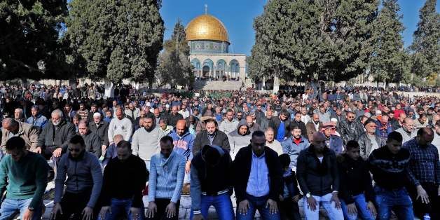 Palestinian Muslim worshippers pray in front of the Dome of the Rock mosque at the al-Aqsa mosque compound in the Jerusalem's Old City on December 8, 2017. Israel deployed hundreds of additional police officers following Palestinian calls for protests after the main weekly Muslim prayers against US President Donald Trump's recognition of Jerusalem as Israel's capital. / AFP PHOTO / Ahmad GHARABLI (Photo credit should read AHMAD GHARABLI/AFP/Getty Images)